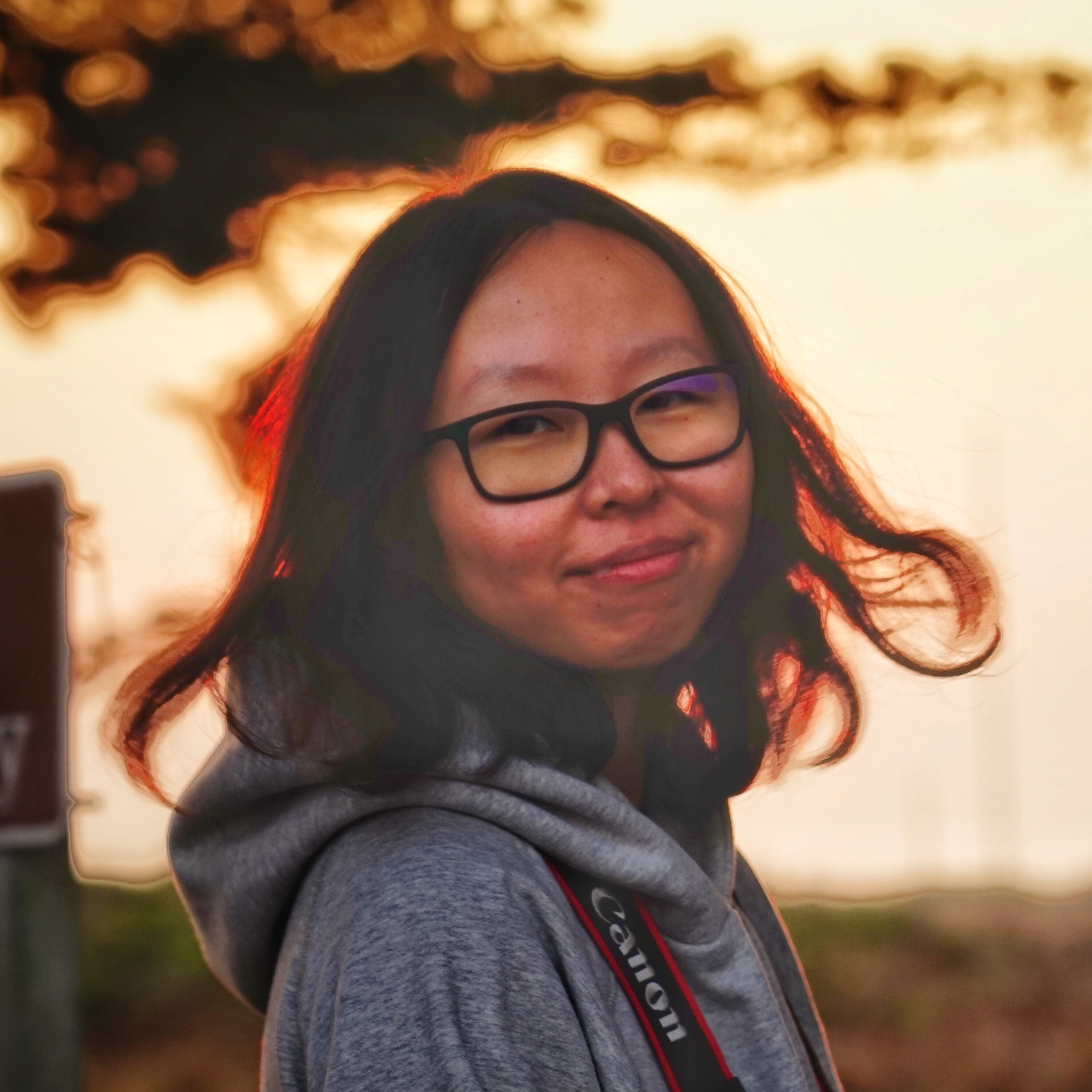 Portrait of Yi Ding in warm evening light.